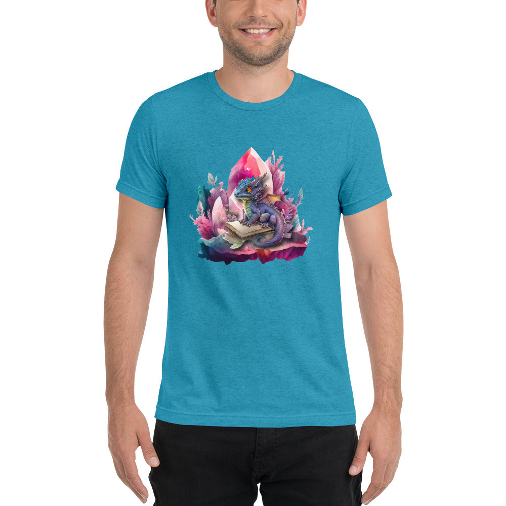 Een aqua triblend unisex T-shirt met een afbeelding van een kleine draak en een magisch boek, gedragen door een blije man, op een witte achtergrond, de man staat naar voren gericht.